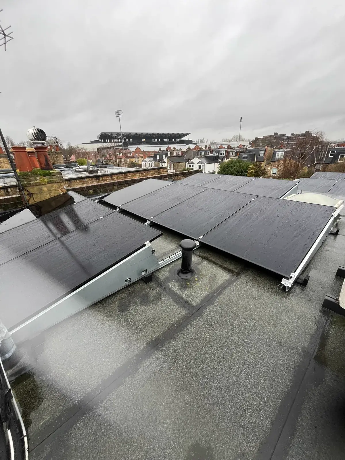 Flat roof solar installation on urban building