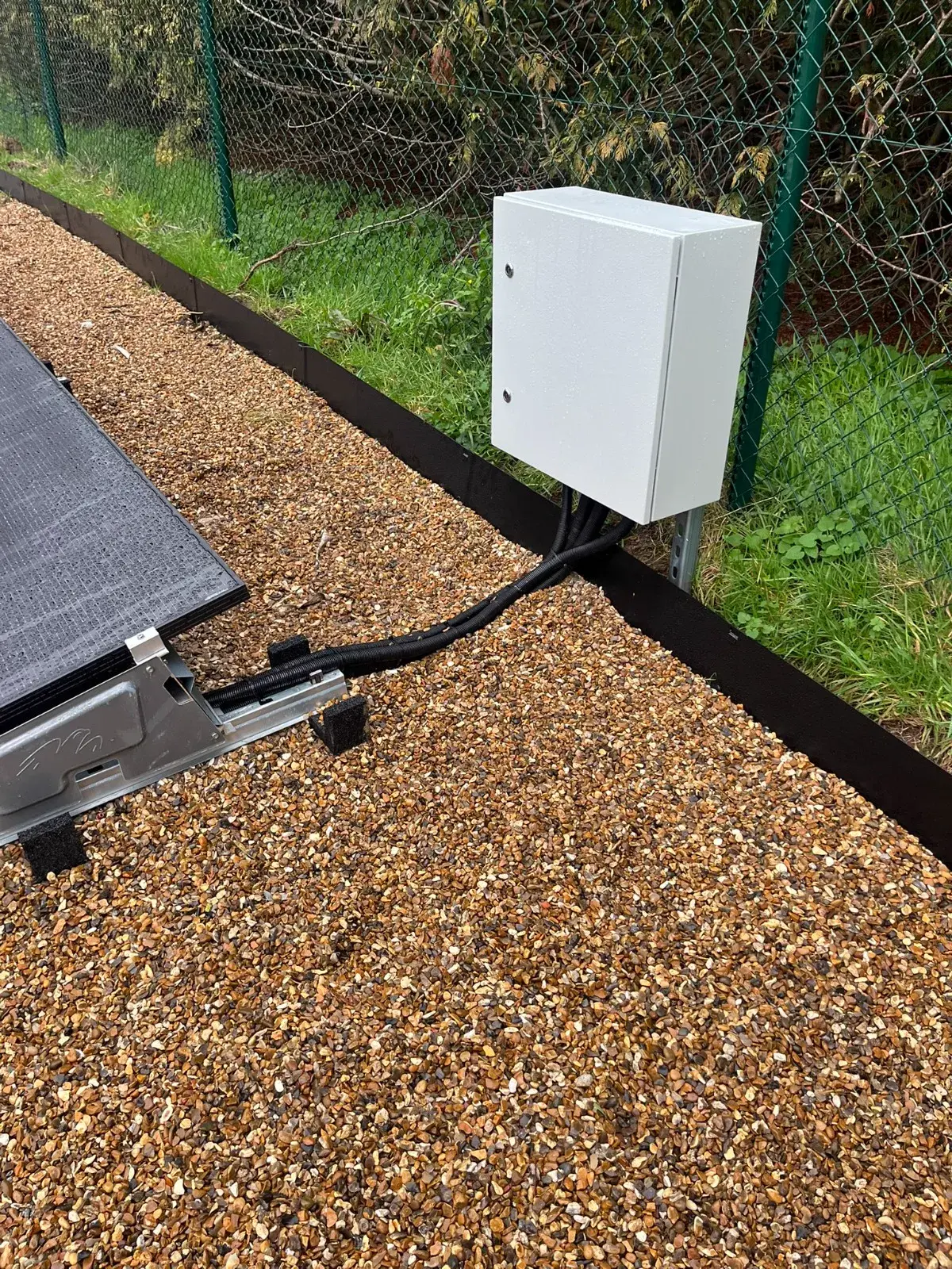 Ground-mounted solar array cabling and control box detail