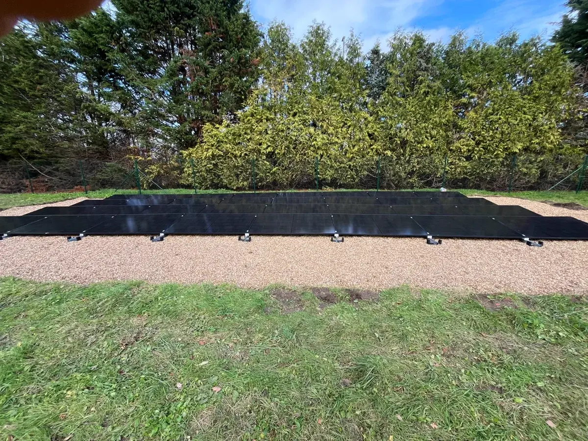 Ground-mounted solar array in garden setting