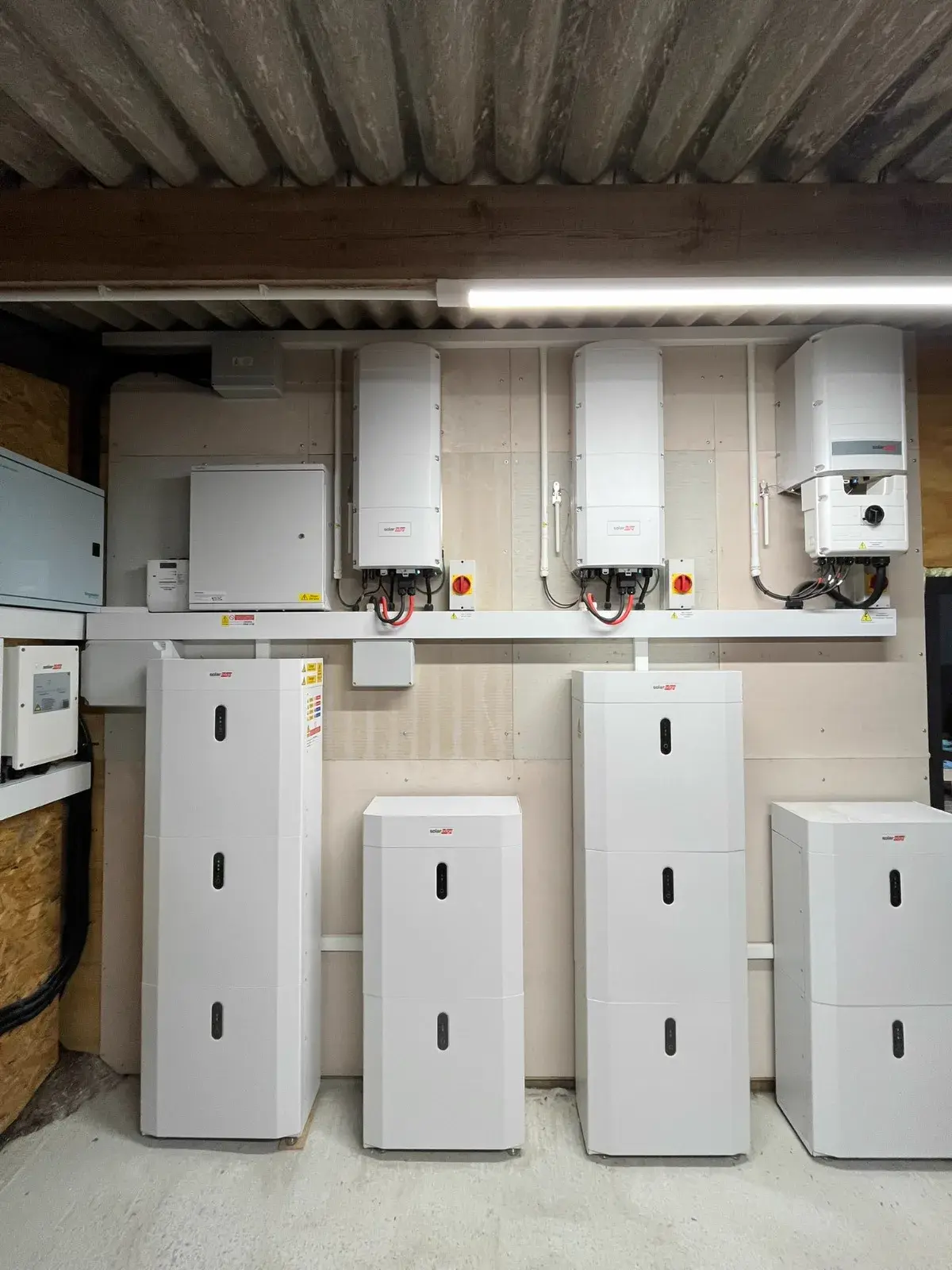 Large commercial SolarEdge multi-inverter and battery wall installation