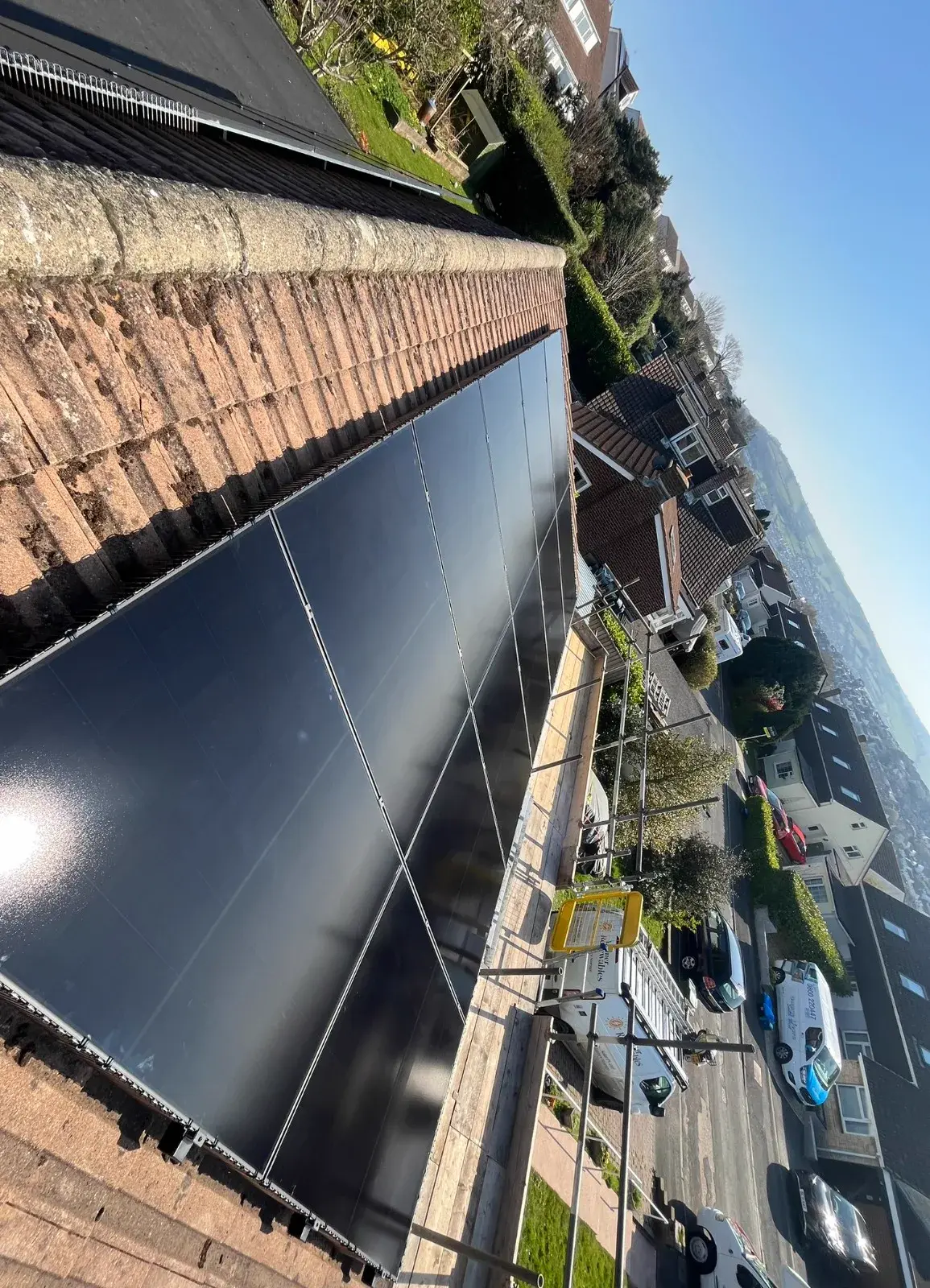 Flat roof solar array with coastal estuary view