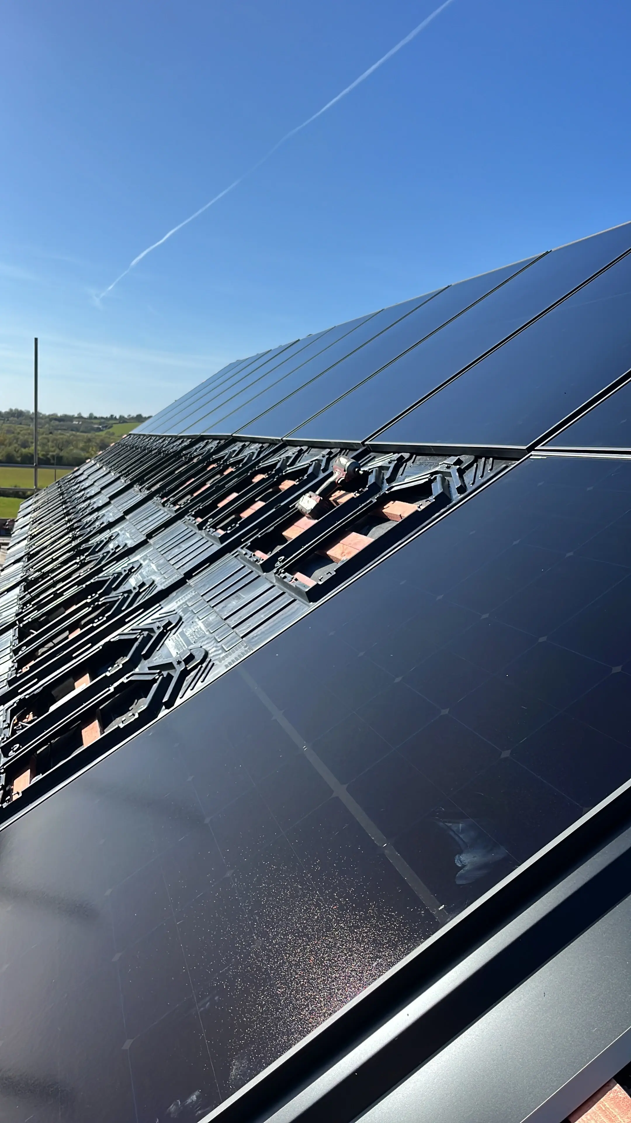 Completed solar array on barn roof overlooking Devon coastline