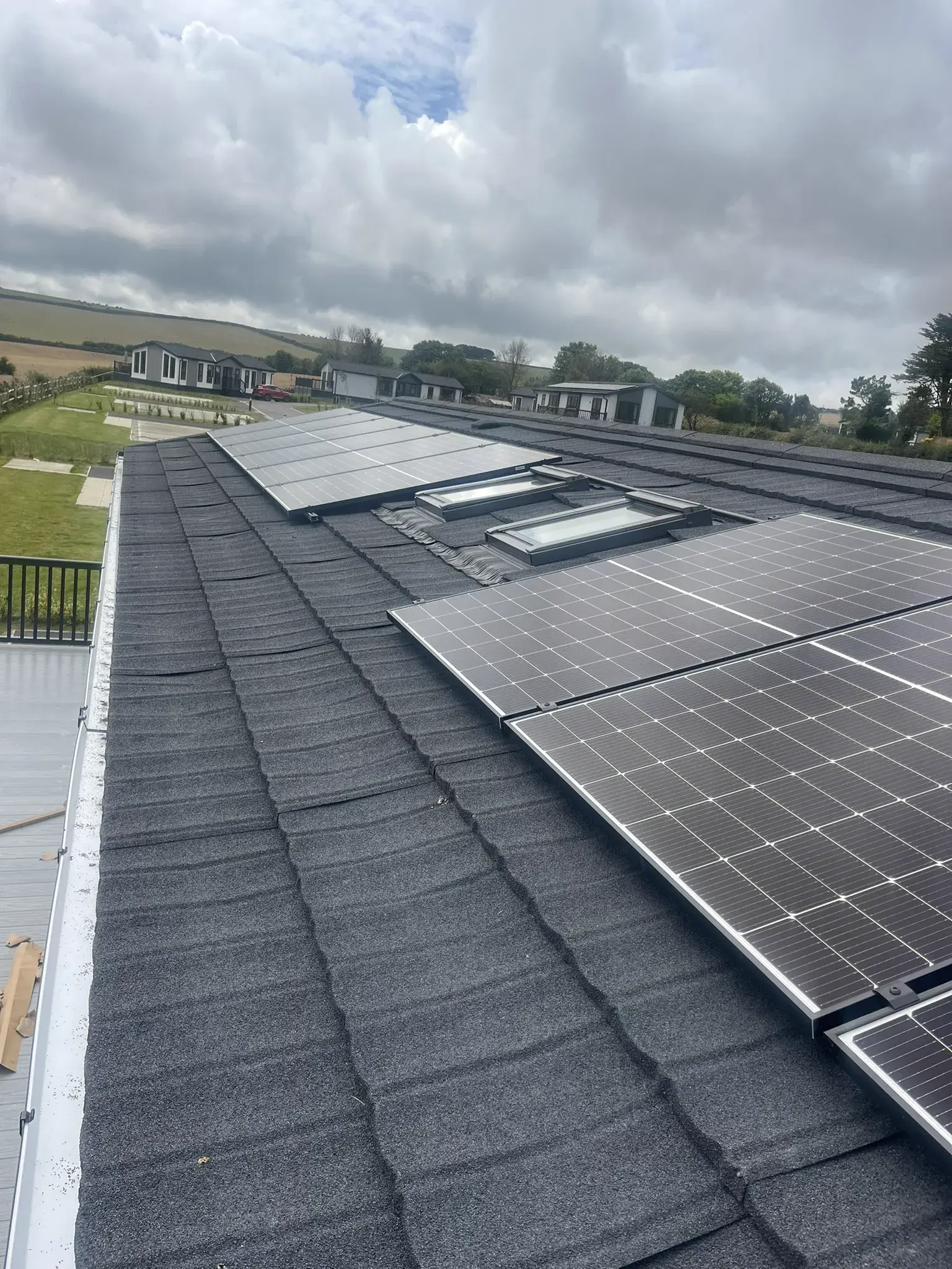 Solar panels installed around roof skylight