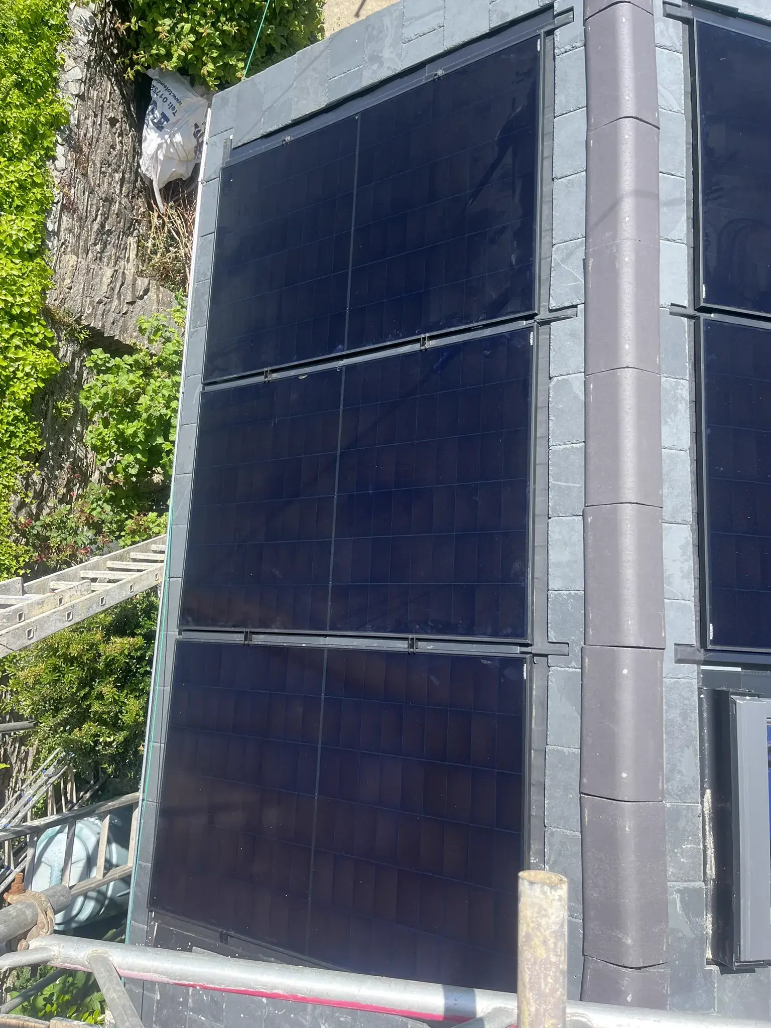 Vertical solar panels mounted on building wall