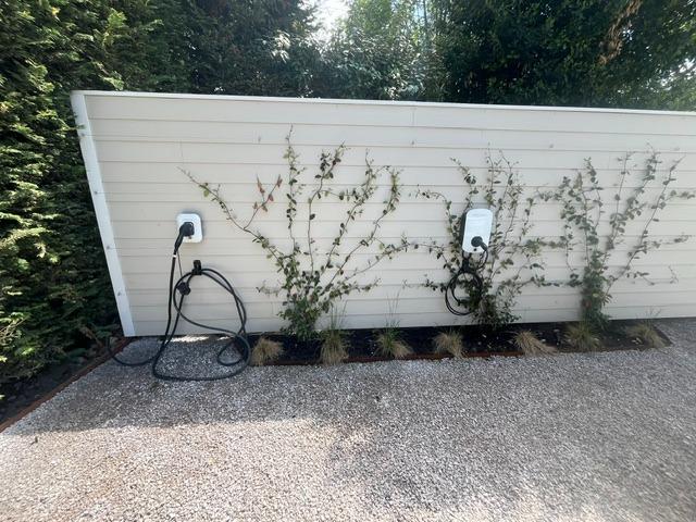 Two EV chargers installed on a wall