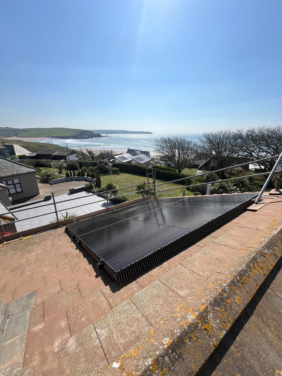 On-roof solar panels with coastal view